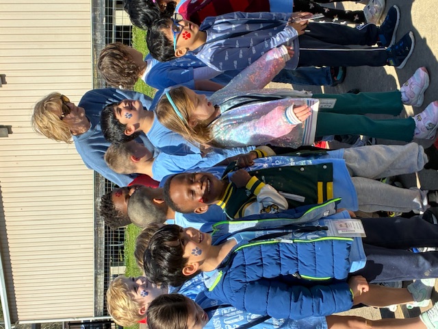 Children smiling together at a community event